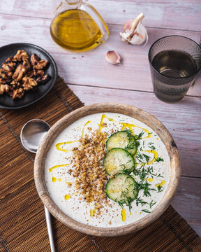 Bowl with soup tarator placed on table