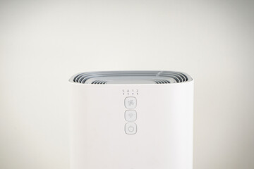 Air purifier with ionization in the room on a light background, close-up.