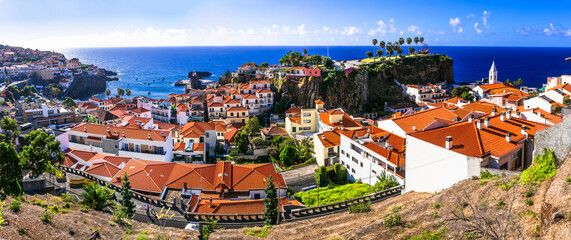 Charming traditional fishing village Camara de Lobos. Madeira island travel and landmarks. Portugal - obrazy, fototapety, plakaty