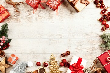 Christmas background with gift boxes and decorations on wooden table