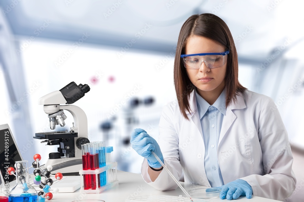 Poster Serious concentrated young medical scientist, pharma chemist, biotech company employee, lab assistant