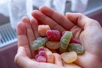 Woman holding colorful candies.
