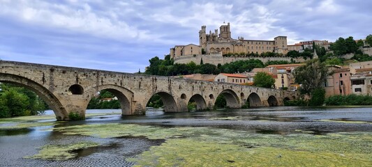 Fototapeta na wymiar The old bridge leading towards the cathedral of Beziers, France