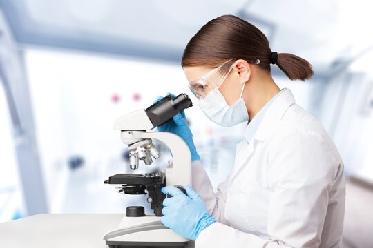 Serious concentrated young medical scientist, pharma chemist, biotech company employee, lab assistant
