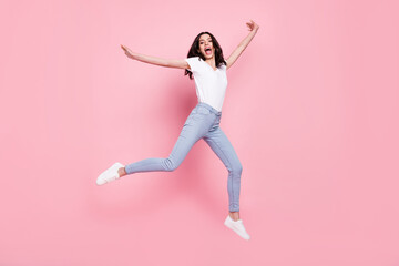 Full body photo of cheerful young crazy happy woman jump up enjoy sale isolated on pink color background