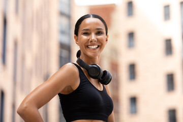 Cheerful Young Woman In Sportswear Posing Outdoors During Fitness Training