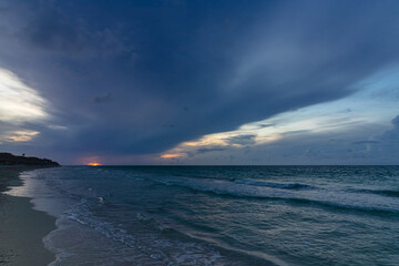 Beautiful sunset on the ocean shore in the evening