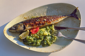 Grilled fish ( mackerel ) with green leafy vegetables