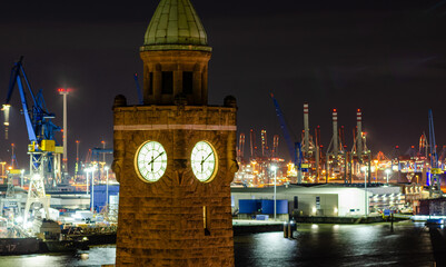 The clock tower of St. Pauli Landungsbruecken in Hamburg at night, Germany