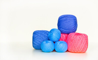 Balls of multicolored yarn, great designs for any purpose. White background. Hobby concept.