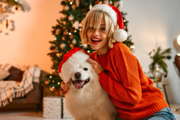 Couple in love for New Year and Christmas with a dog at home