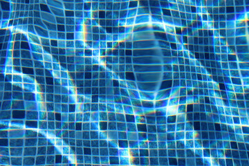 Swimming pool blue tiles through water