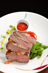 Roasted Kobe Marbled beef fillets with snow peas and tomato sauce