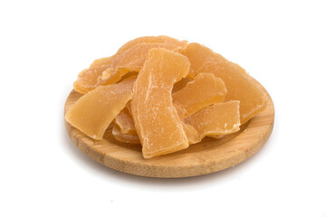 plate with candied ginger on white background