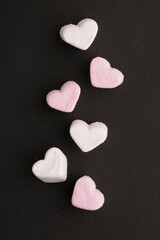 Obraz premium heart shaped marshmallow on black background
