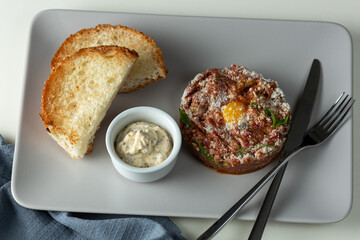 beef tartare with sauce and toast