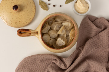 russian dumplings in pottery, flat lay