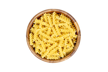Top view of yellow uncooked fusilli pasta in round wooden bowl isolated on white background.