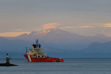 Canadian Coast Guard Ship against sunset mountains in Port Hardy, B.C