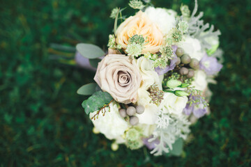 Beautiful wedding bouquet with different flowers, roses