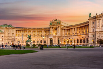 Fototapeta na wymiar Hofburg palace and statue of Prince Eugene on Heldenplatz square at sunset, Vienna, Austria
