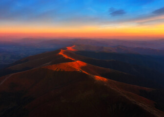 Aerial view on Carpathians mountains peak at sunset