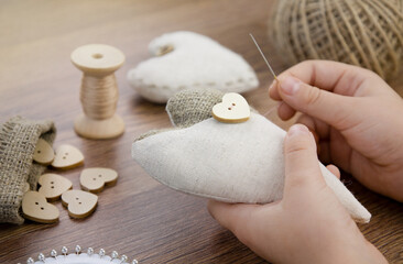 The heart is made of cotton fabric,buttons and spools of thread. Valentine's day.The concept of...