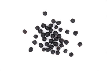 Dried aronia berries isolated on white background