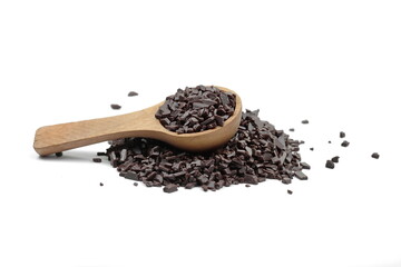 Chocolate sprinkles in a wooden spoon isolated on white background. Grated chocolate isolated on white background.