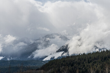 Moody landscape early spring with mountains and overcast clouds