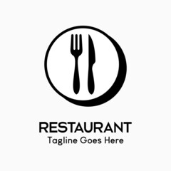 Fototapeta na wymiar Cutlery icon. fork and knife on a plate in a circle. logo for restaurant business, simple, luxury and modern vector illustration