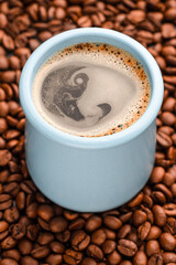 americano coffee, coffee beans, blue mug, non-ground coffee beans