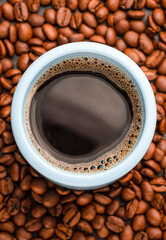 americano coffee, coffee beans, blue mug, non-ground coffee beans
