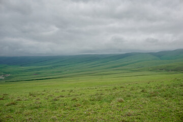 Fototapeta na wymiar Green meadows in the mountains of Dagestan