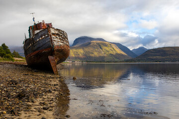 Old Boat of Caol and Ben Nevis in Scotland, UK.