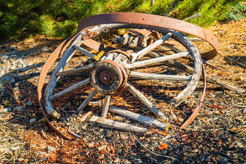 broken antique wooden wheel 
