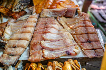 Dried and smoked  fish at the fish market. Salmon and silver carp. Market "Privoz", Odessa, Ukraine.