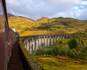 Jacobite Express Steam Train on the Glenfinnan Viaduct in the Scottish Highlands, UK