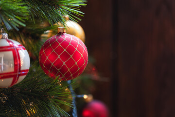 Close-up of Christmas tree decorated with white, gold and red ornaments