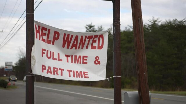 Help Wanted sign hanging by side of a rural West Virginia road in autumn.