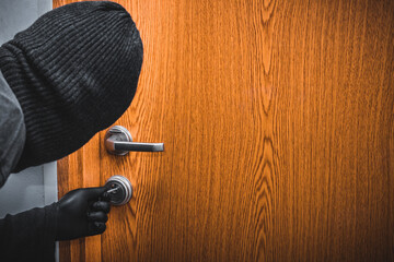 A man in a black balaclava and gloves breaks into the apartment at night with a lockpick, Home...