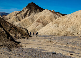 Fototapeta na wymiar Hikers along the Golden Canyon and Gower Gulch Trails, Death Valley National Park
