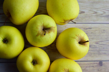 Top view, yellow apples on old woods. 