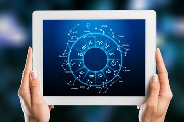 Astrological zodiac horoscope Mobile application concept. hands holding mobile phone