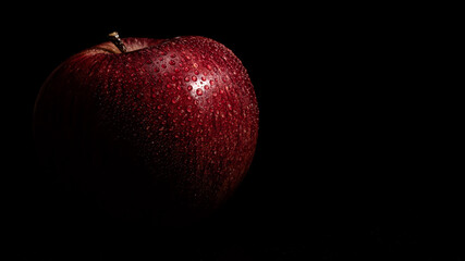 Fototapeta na wymiar red apple on black background