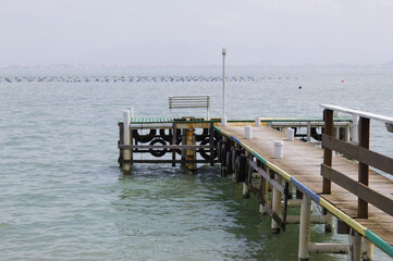Pier on sambaqui beach in Florianópolis, Brazil