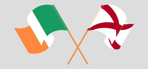 Crossed and waving flags of Ireland and The State of Alabama