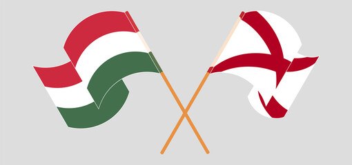 Crossed and waving flags of Hungary and The State of Alabama