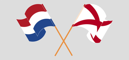 Crossed and waving flags of the Netherlands and The State of Alabama