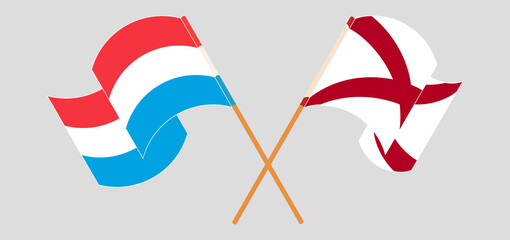 Crossed and waving flags of Luxembourg and The State of Alabama
